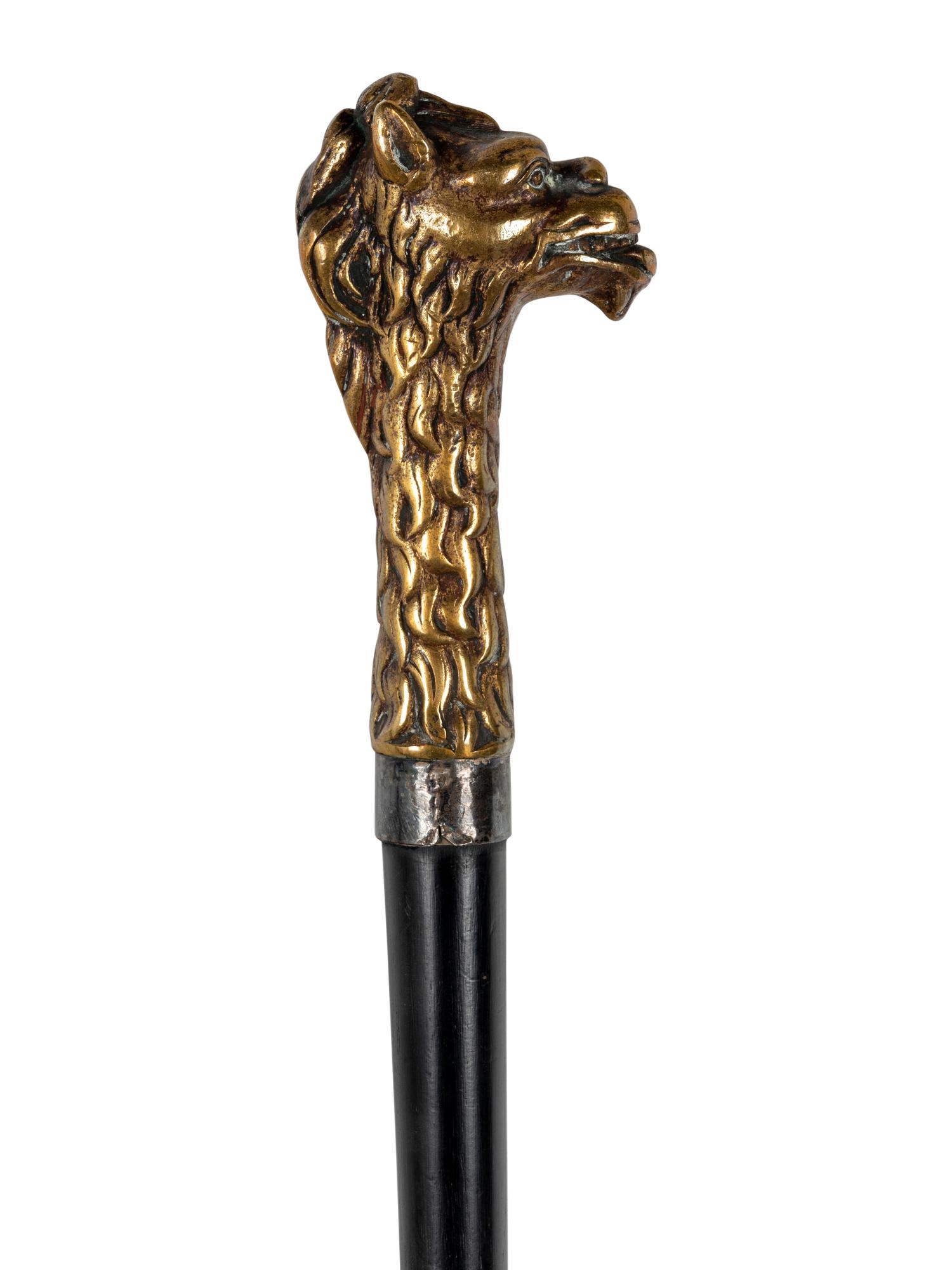 Two Figural Walking Sticks or Canes