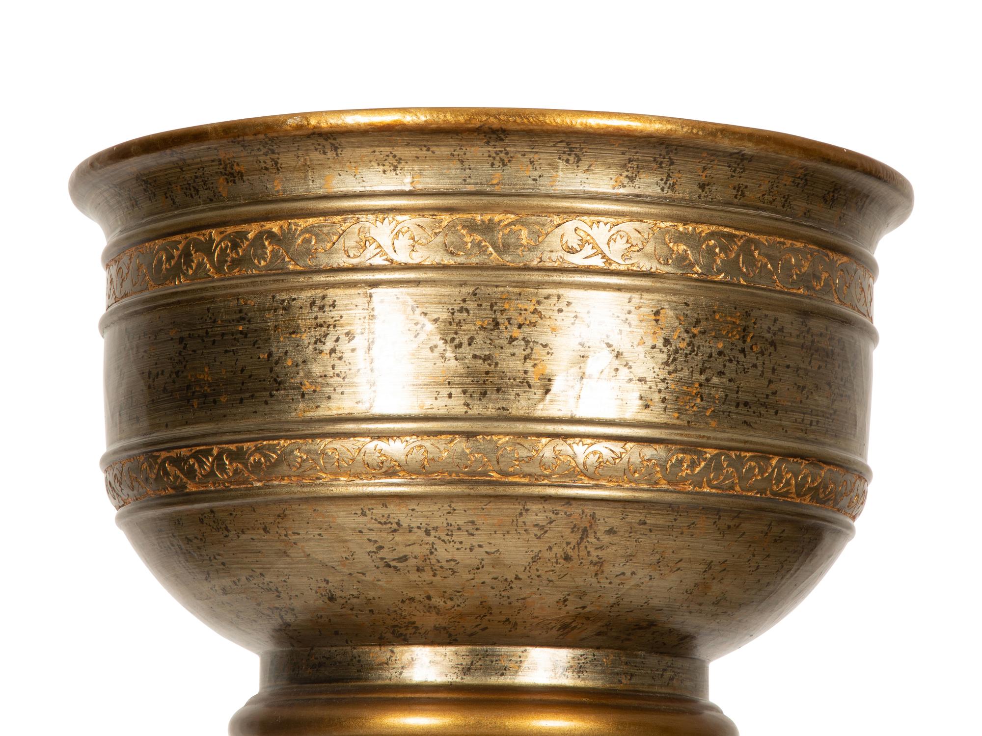 A Contemporary Silvered and Gilt Decorated Wood Urn on Pedestal Base