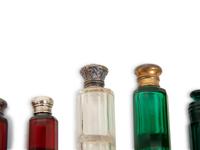 Eight English Silver or Brass-Mounted Glass Scent Bottles