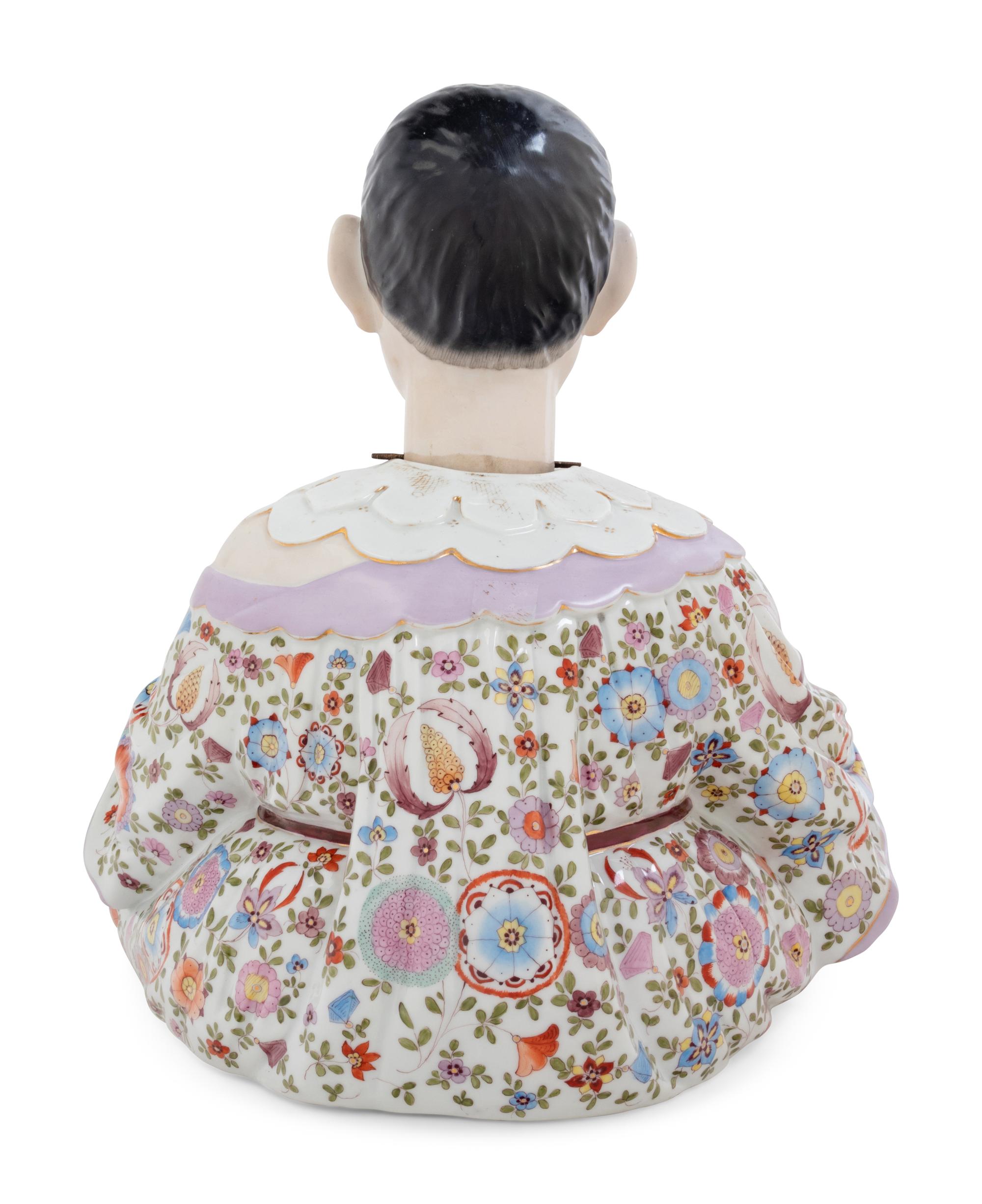 A German Porcelain "Nodder" Figure
