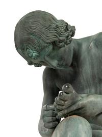 A Patinated Bronze Figure of the Spinario