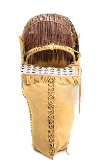 An Apache Wood, Hide and Twig Cradleboard Height 24 x width 11 3/4 inches. — 20th CENTURY