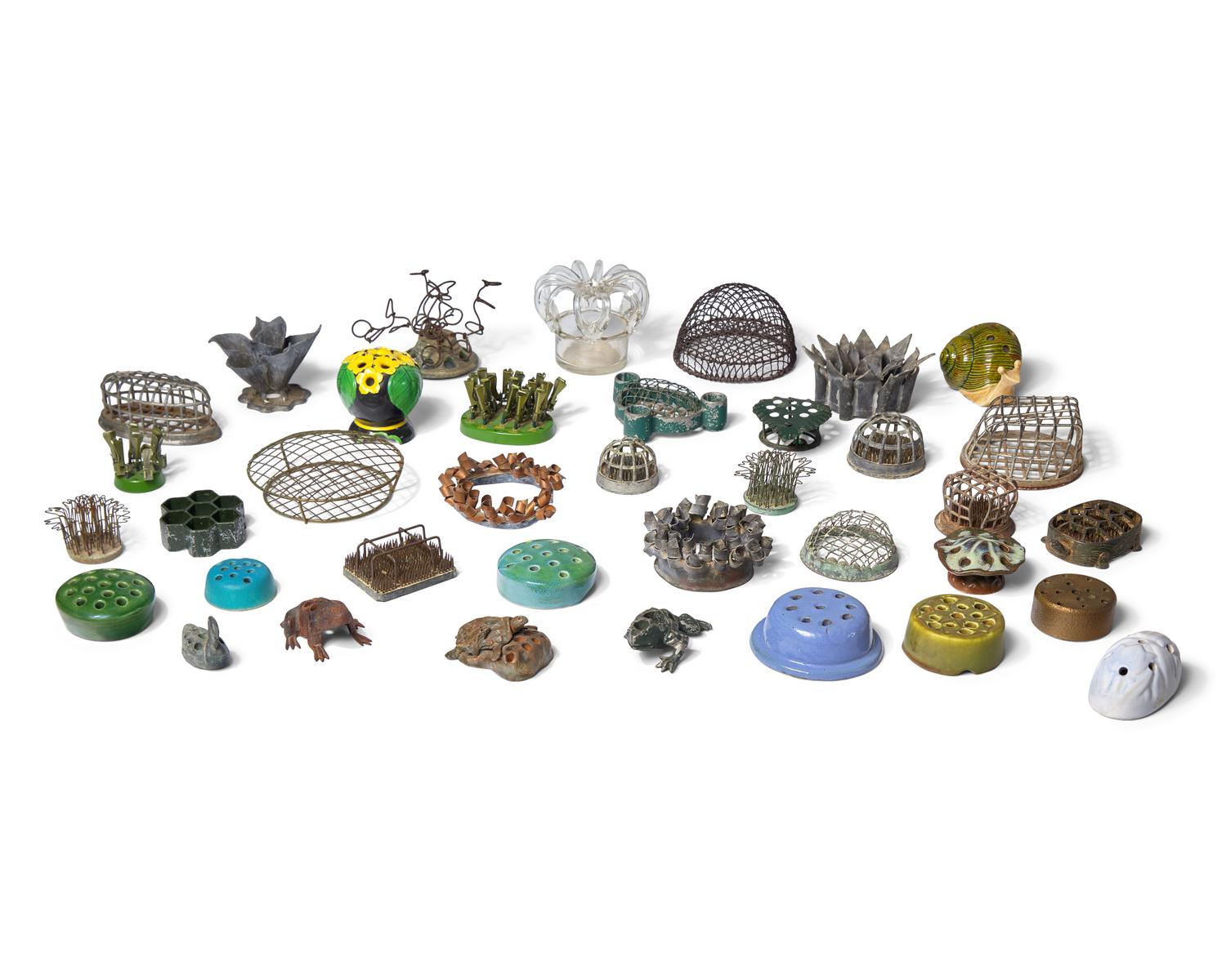 A Large Collection of Thirty-Seven Flower Frogs or Holders