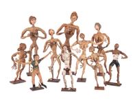 Eighteen Painted Rubber Folk Art Figurines