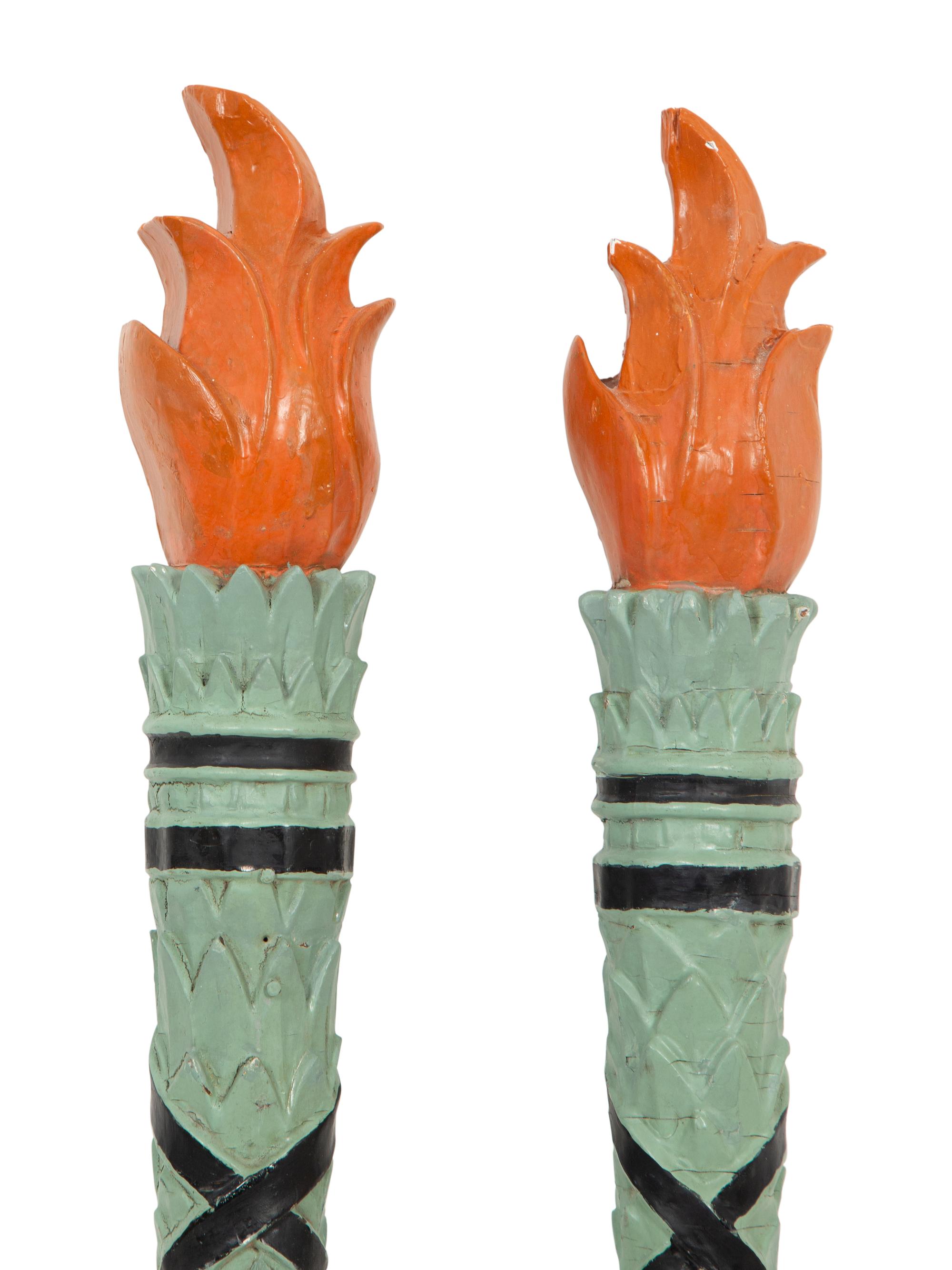 A Pair of Continental Carved and Painted Torch Wall Ornaments
