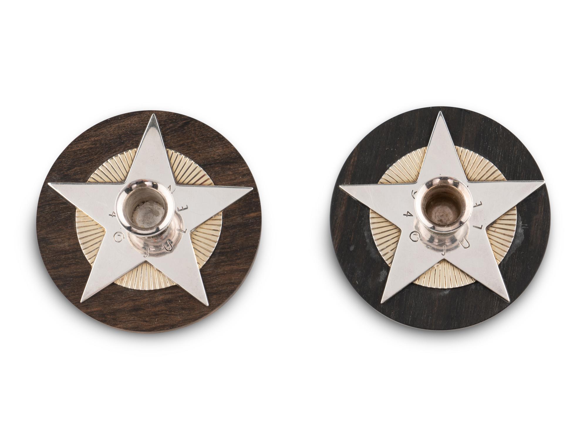 An Associated Pair of Arno Malinowski for Georg Jensen Silver and Ebony Christmas Candle Holders