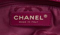 A Chanel Dark Red Caviar Leather Handbag, 11" x 8" x 3.75".
