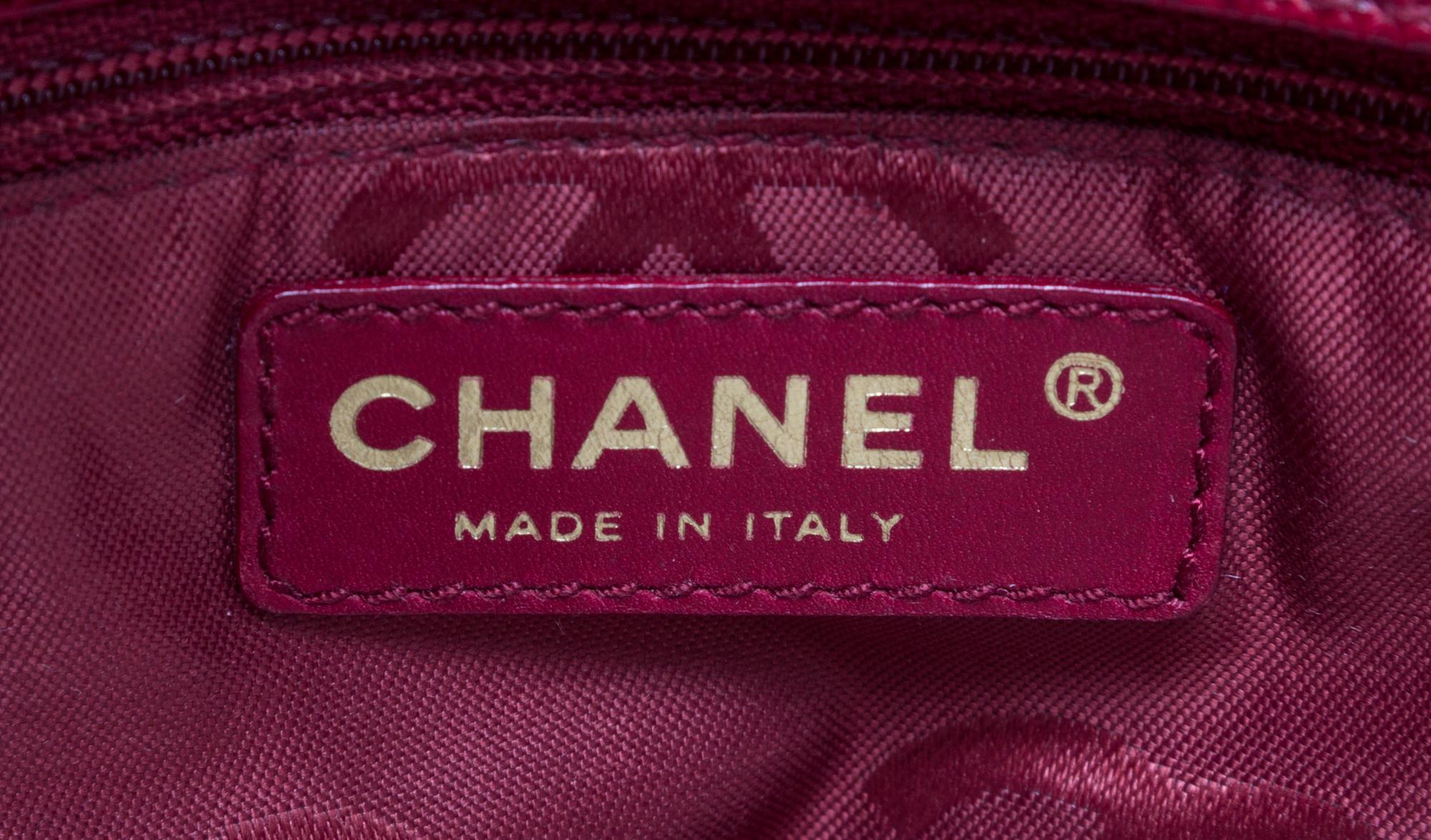A Chanel Dark Red Caviar Leather Handbag, 11" x 8" x 3.75".