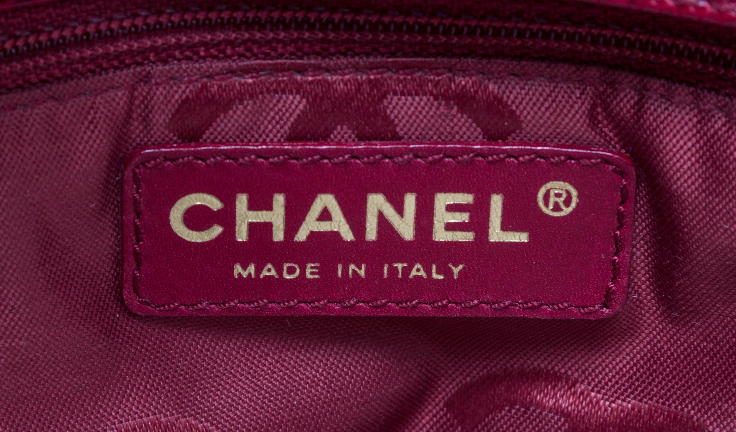 A Chanel Dark Red Caviar Leather Handbag, 11" x 8" x 3.75".