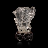 A Chinese Rock Crystal 'Magnolia' Vase with wood stand, 19th Century 清晚期 水晶雕玉蘭花插