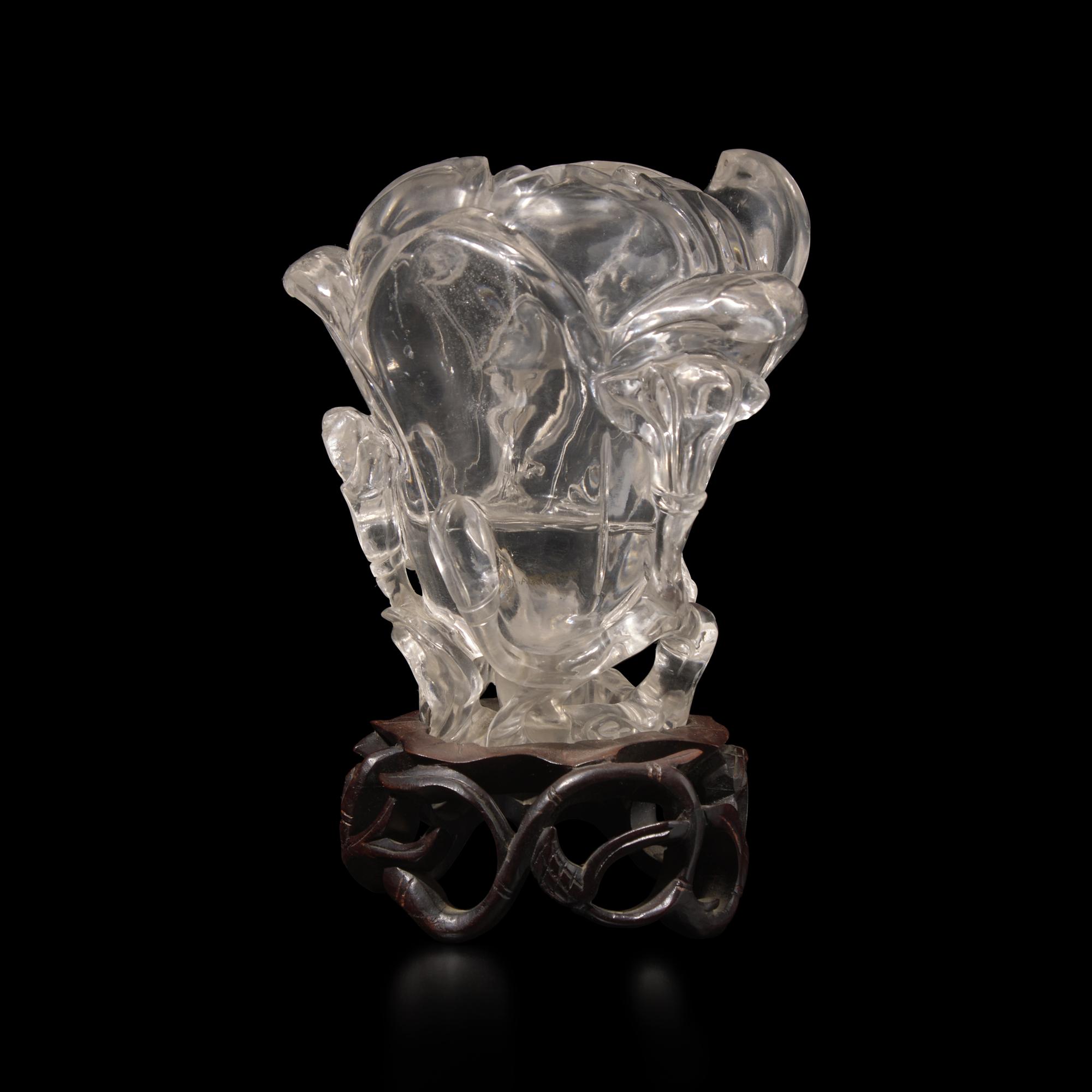 A Chinese Rock Crystal 'Magnolia' Vase with wood stand, 19th Century 清晚期 水晶雕玉蘭花插