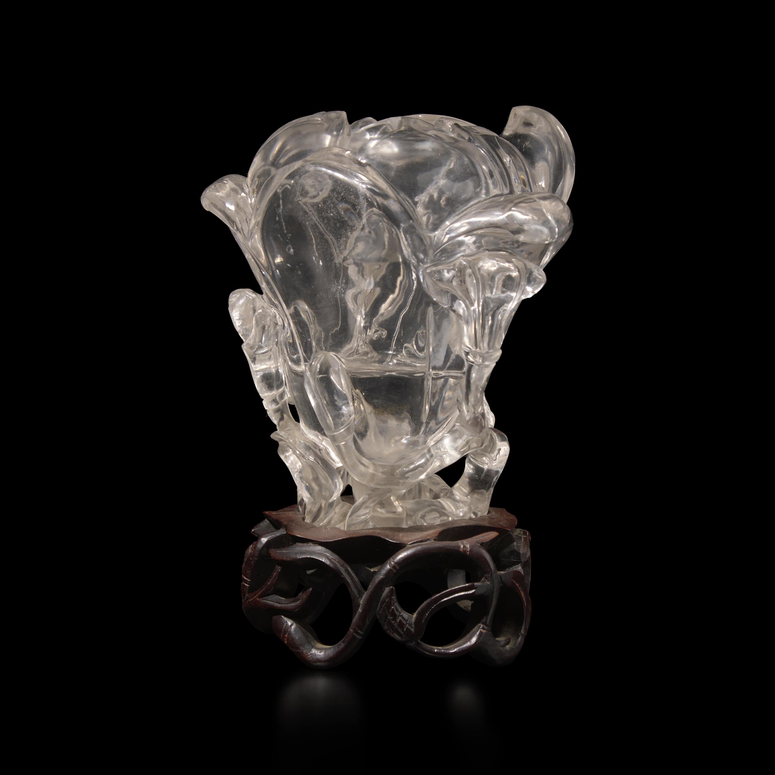 A Chinese Rock Crystal 'Magnolia' Vase with wood stand, 19th Century 清晚期 水晶雕玉蘭花插