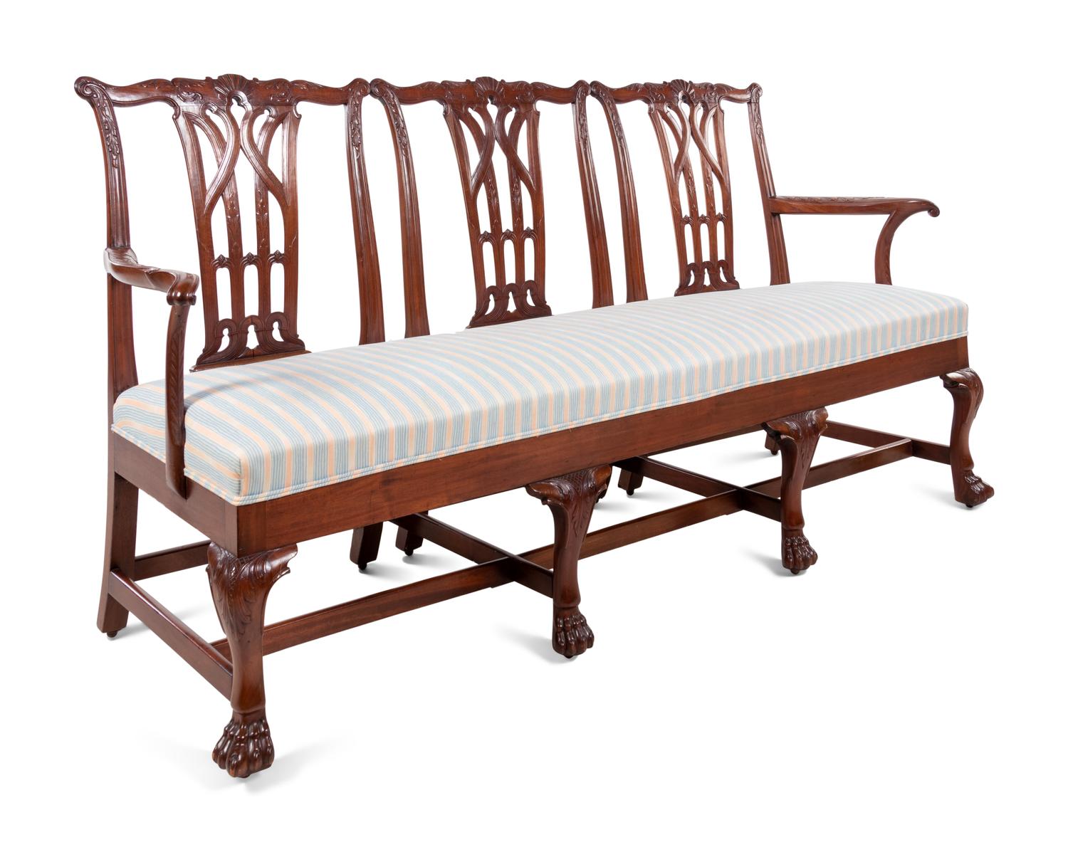 A George III Style Carved Mahogany Triple-Back Settee