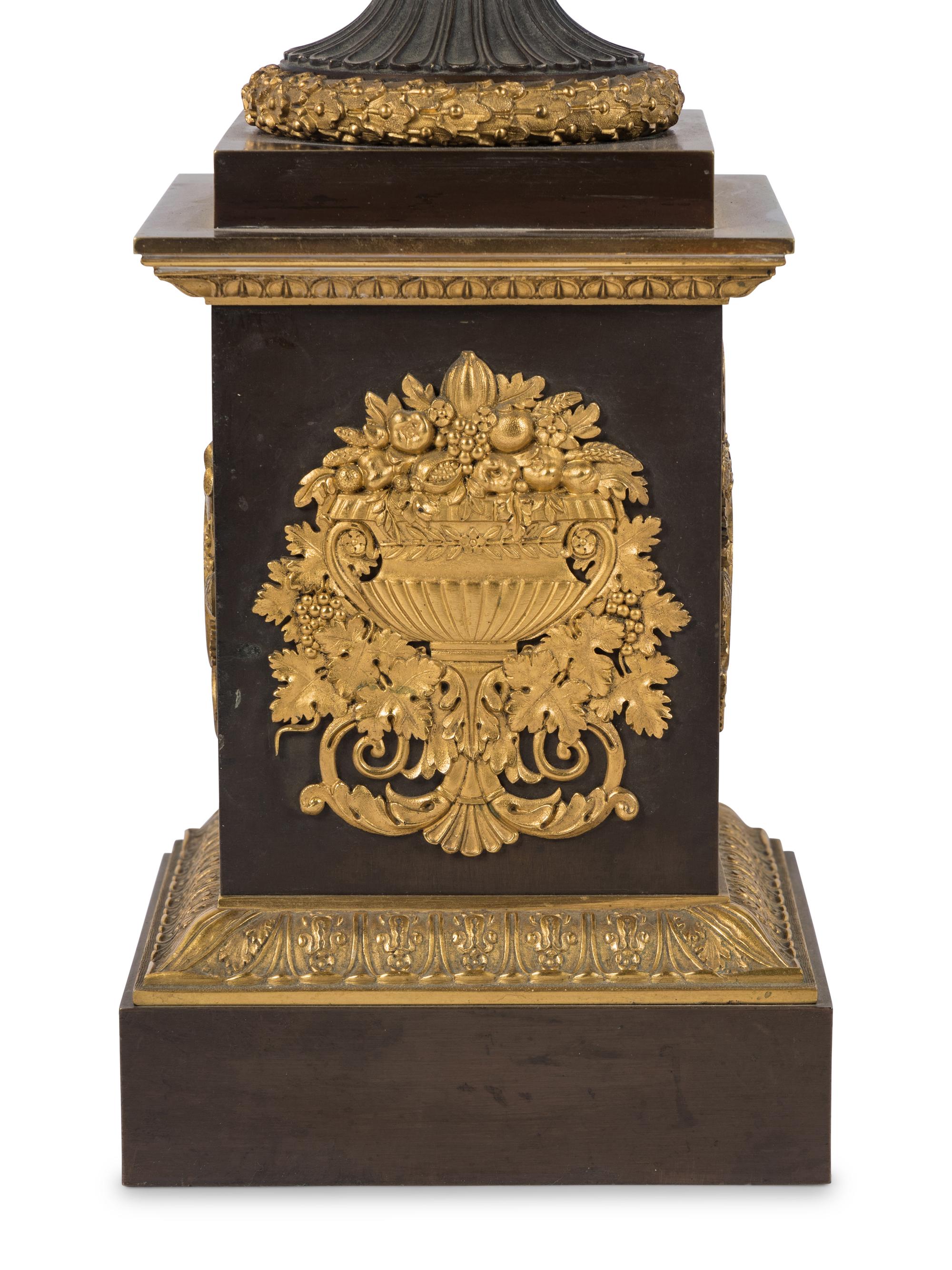 A Pair of Louis Phillippe Parcel-Gilt and Patinated Bronze Urns Mounted as Lamps