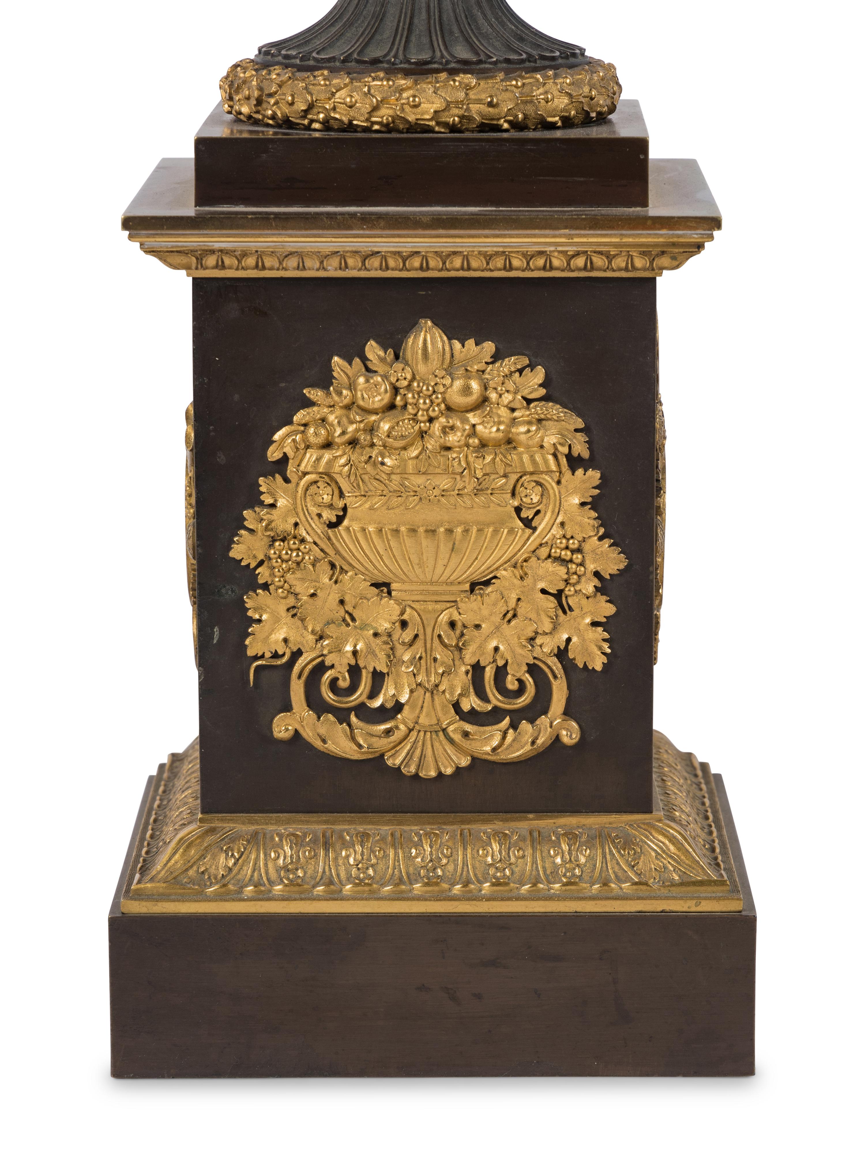A Pair of Louis Phillippe Parcel-Gilt and Patinated Bronze Urns Mounted as Lamps