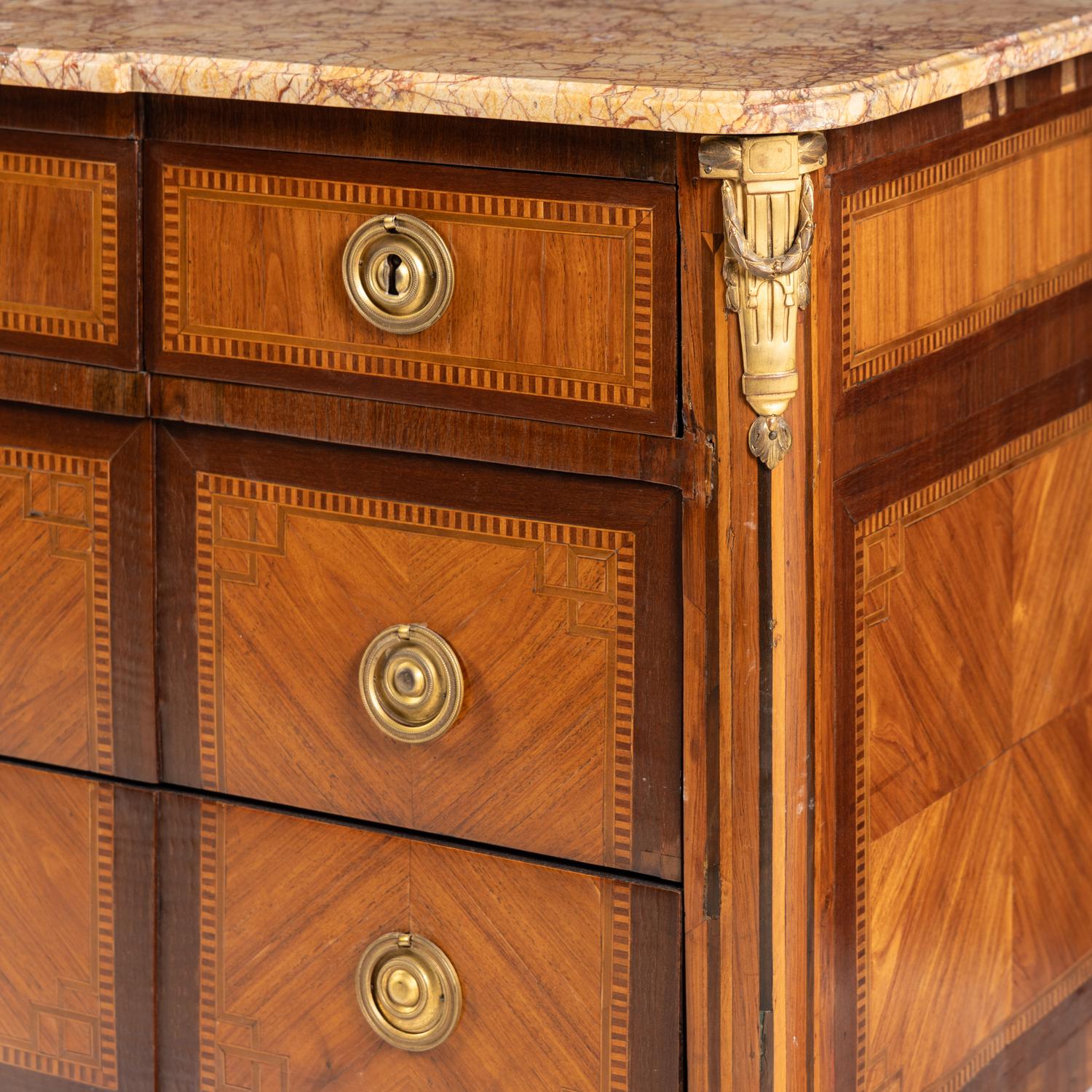 A Louis XVI Gilt Bronze Mounted Tulipwood, Marquetry and Marble-Top Commode