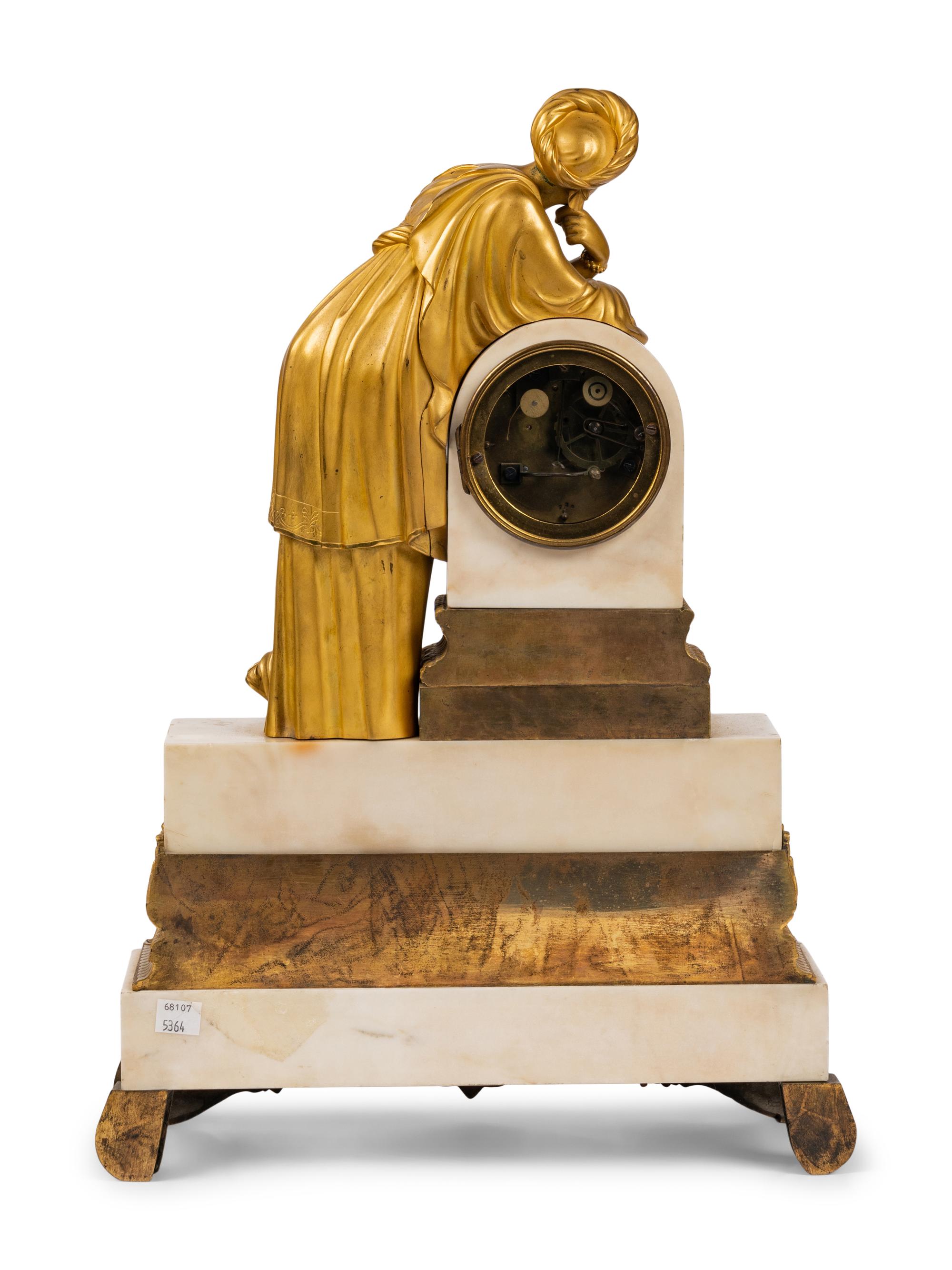 A Louis Philippe Gilt Bronze and White Marble Mantel Clock