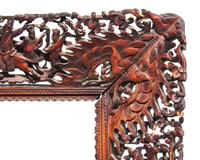 A pair of Chinese Export carved and stained wood frames, 19th century