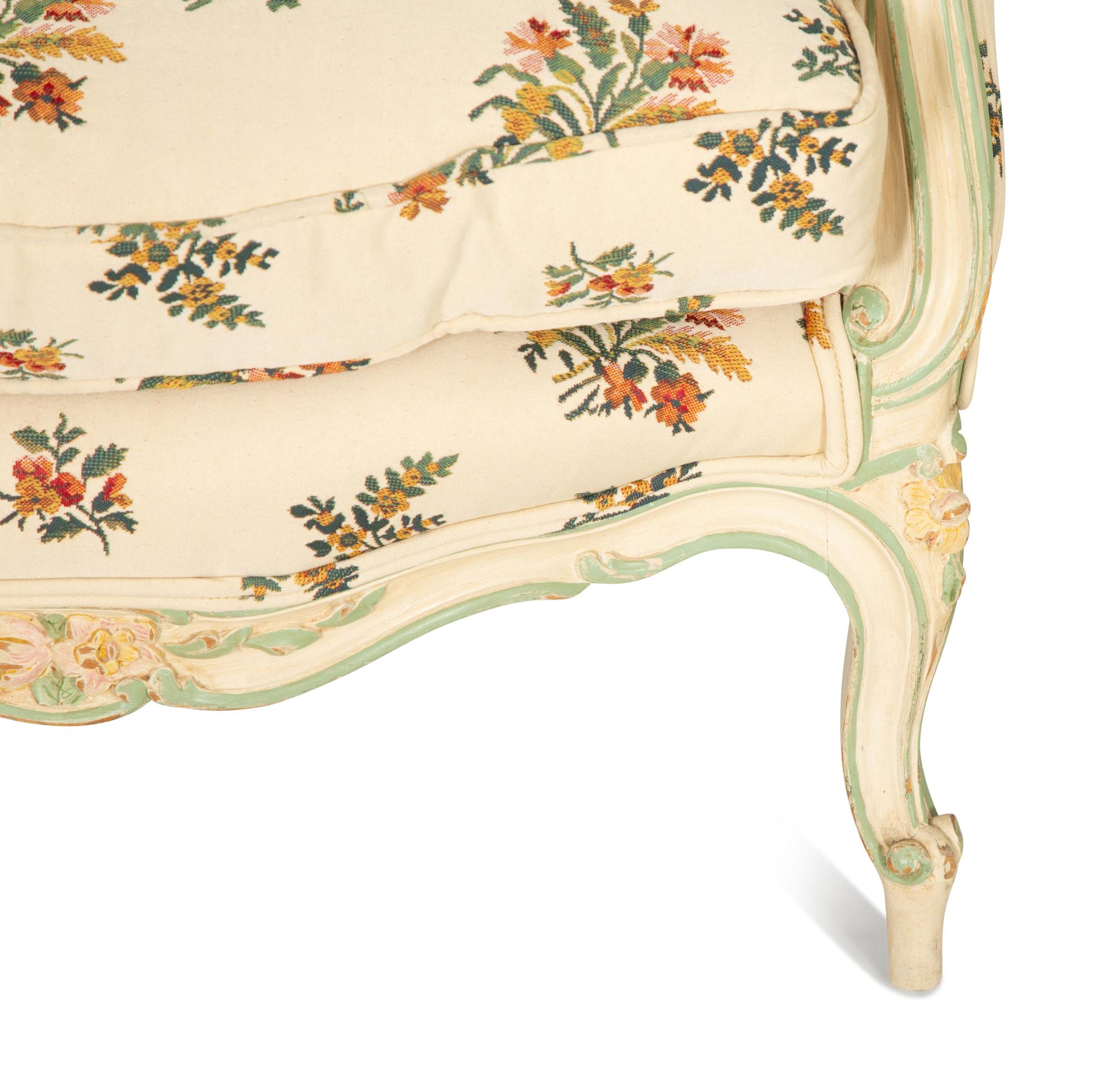 A Pair of Louis XV Style Painted Wingback Bergères and an Associated Stool