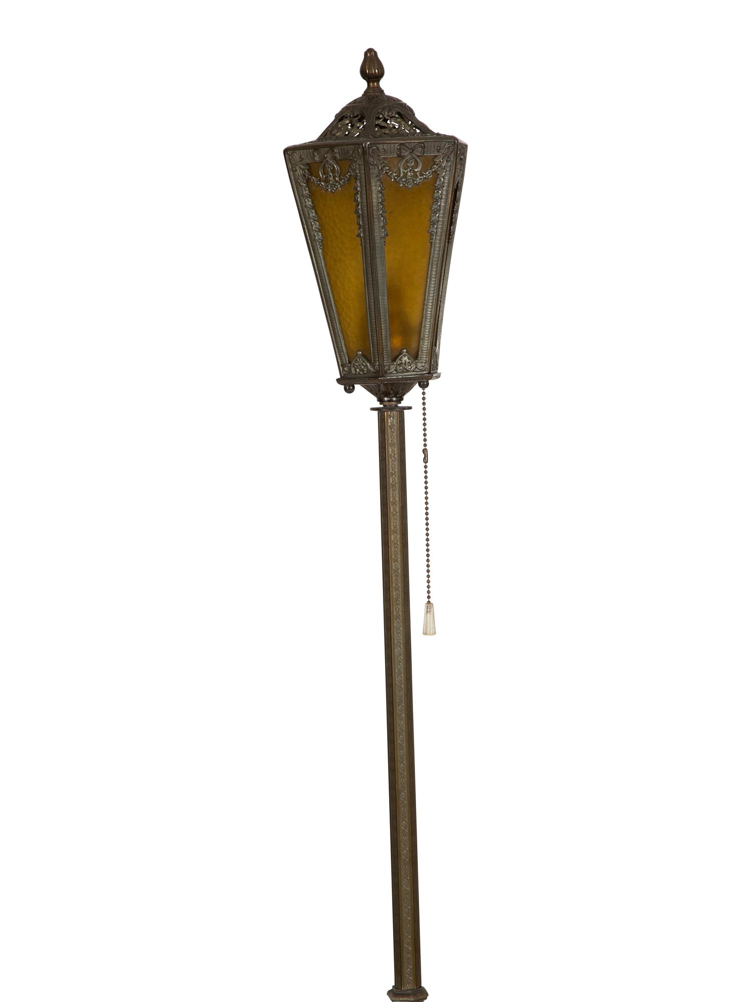 A Pair of Patinated Metal Lantern Style Floor Lamps