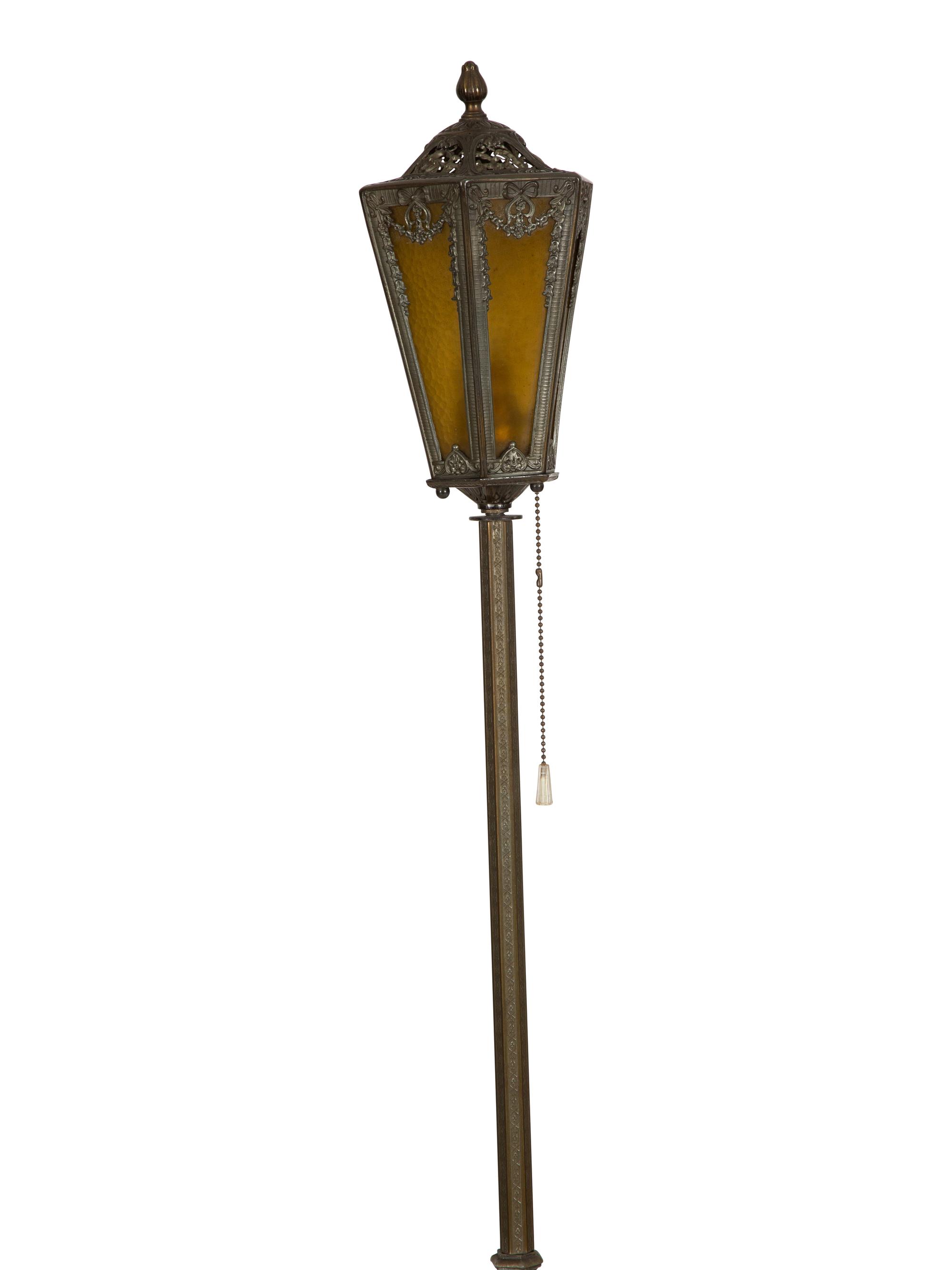 A Pair of Patinated Metal Lantern Style Floor Lamps
