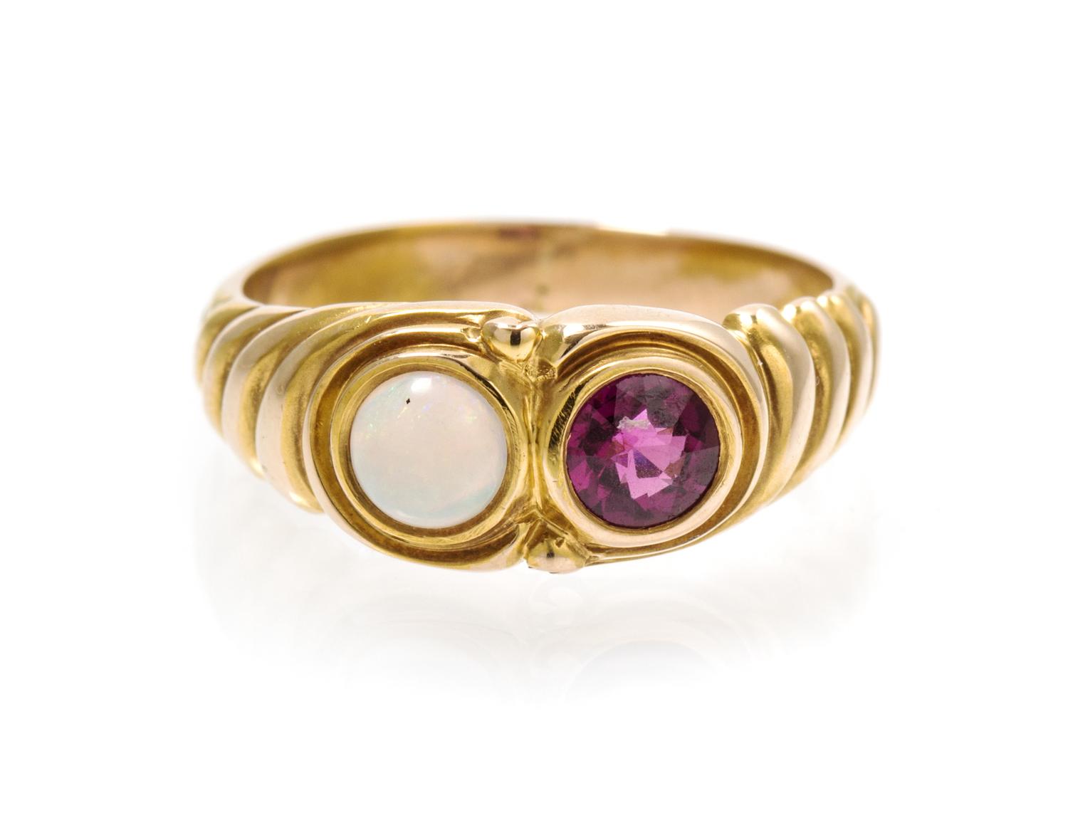 A Yellow Gold, Garnet and White Opal Ring, 3.00 dwts.