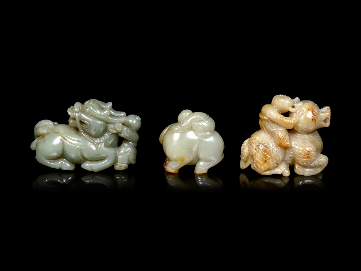 Three Chinese Celadon Jade Figures of Boys