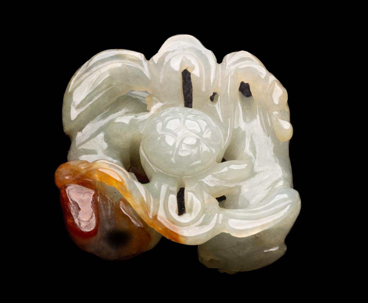 A Chinese Russet and Pale Celadon Jadeite Carving