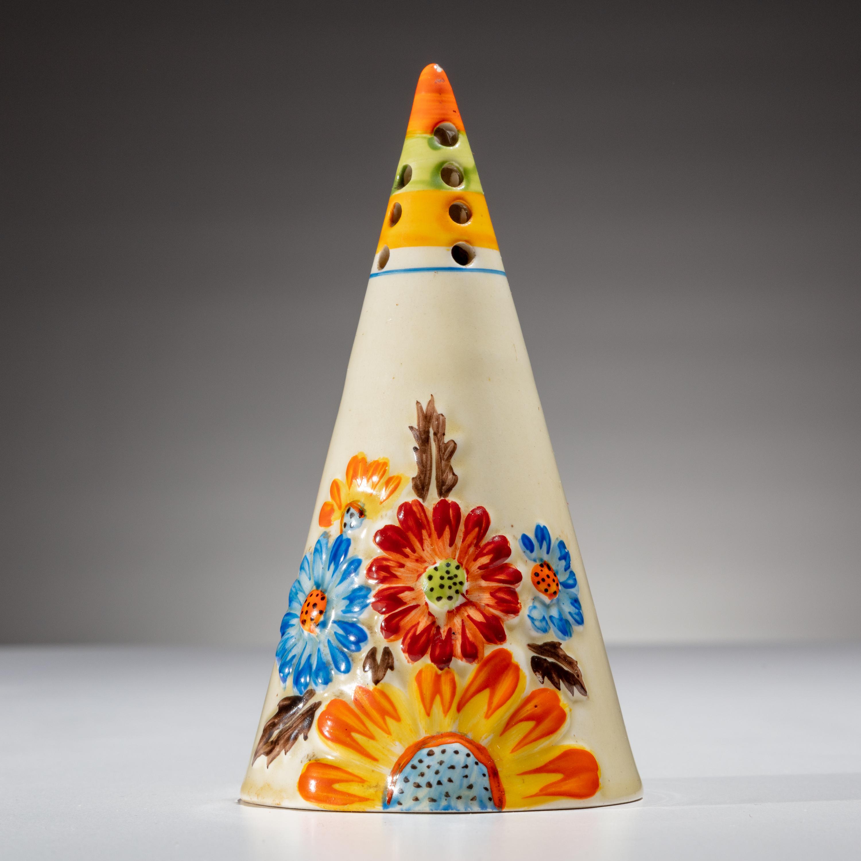 Clarice Cliff (English, 1899–1972) — Collection of 57 Conical Sugar Shakers and Custom Case