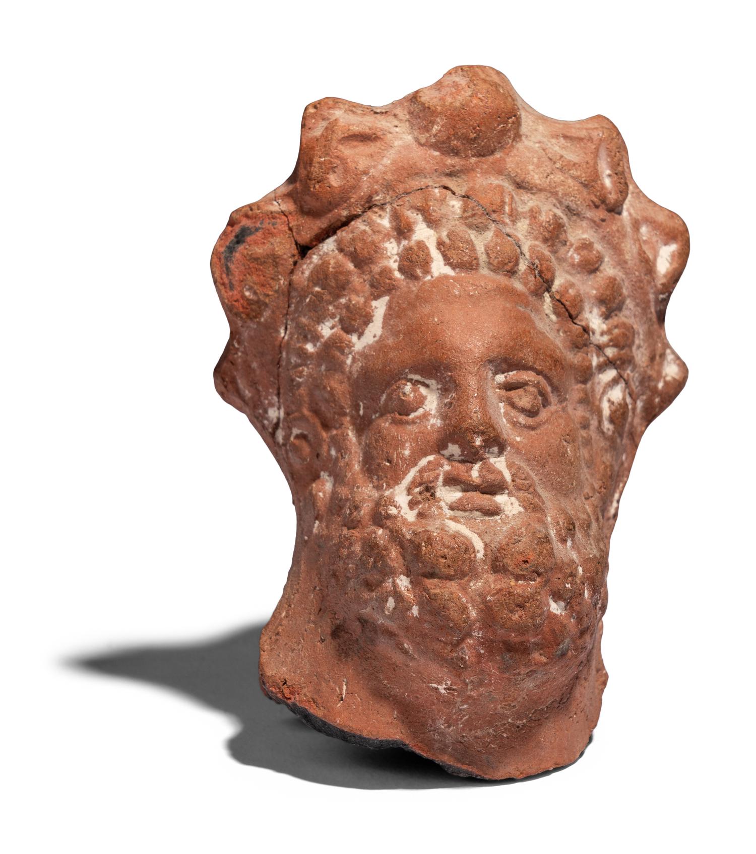 An Egyptian Terracotta Head of Serapis