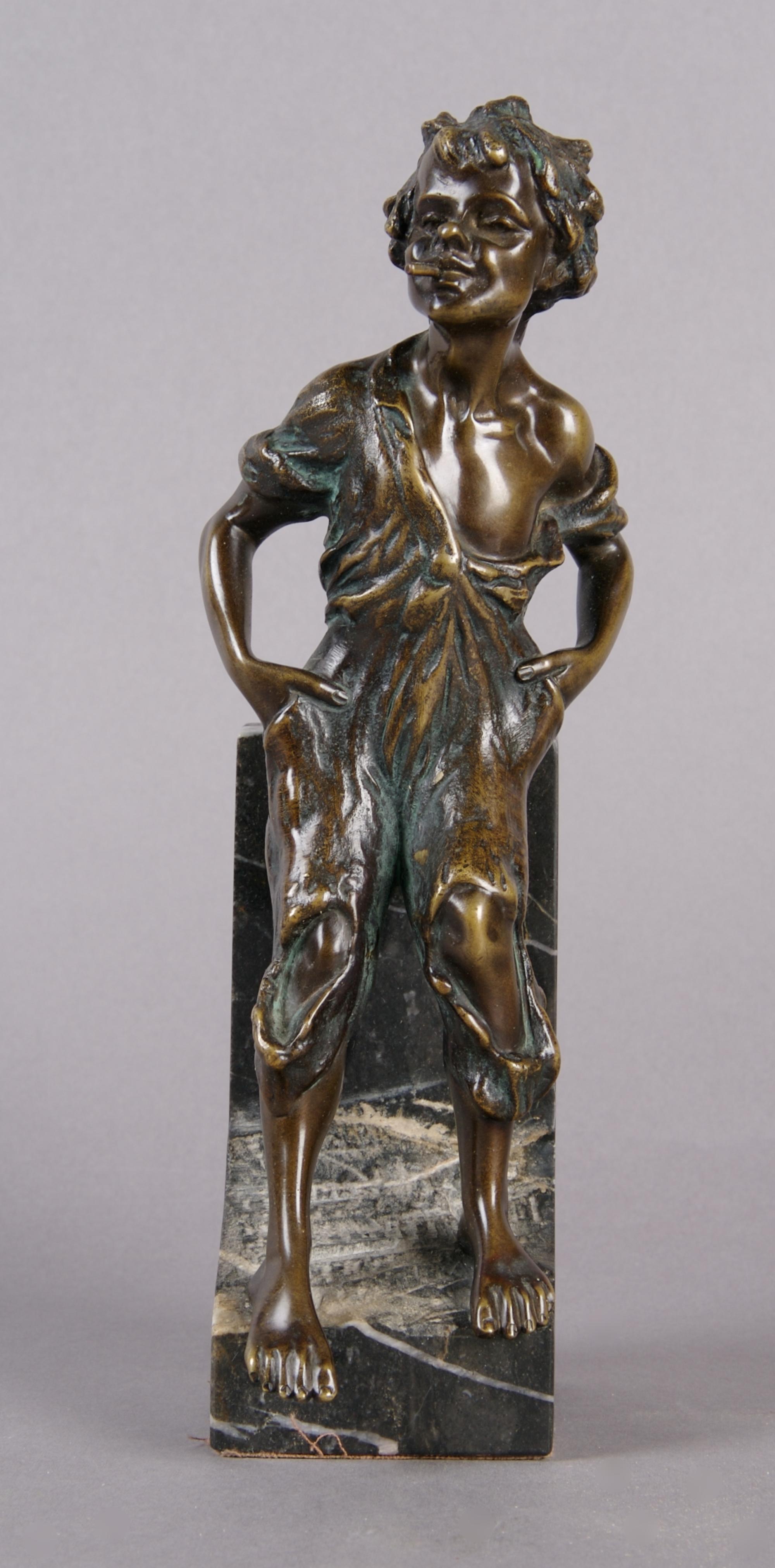 A Continental Bronze Figure of a Boy Smoking, Height 8 inches.