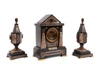 An Egyptian Revival Marble and Patinated Bronze Mantel Clock Garniture