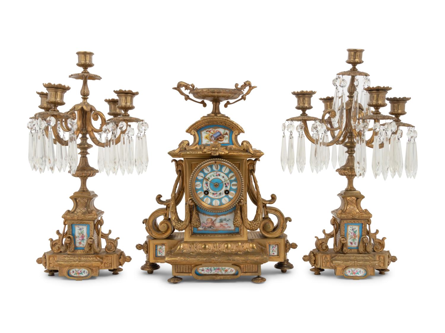 A Napoleon III Style Gilt Bronze and Sèvres Style Porcelain Clock Garniture