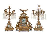 A Napoleon III Style Gilt Bronze and Sèvres Style Porcelain Clock Garniture