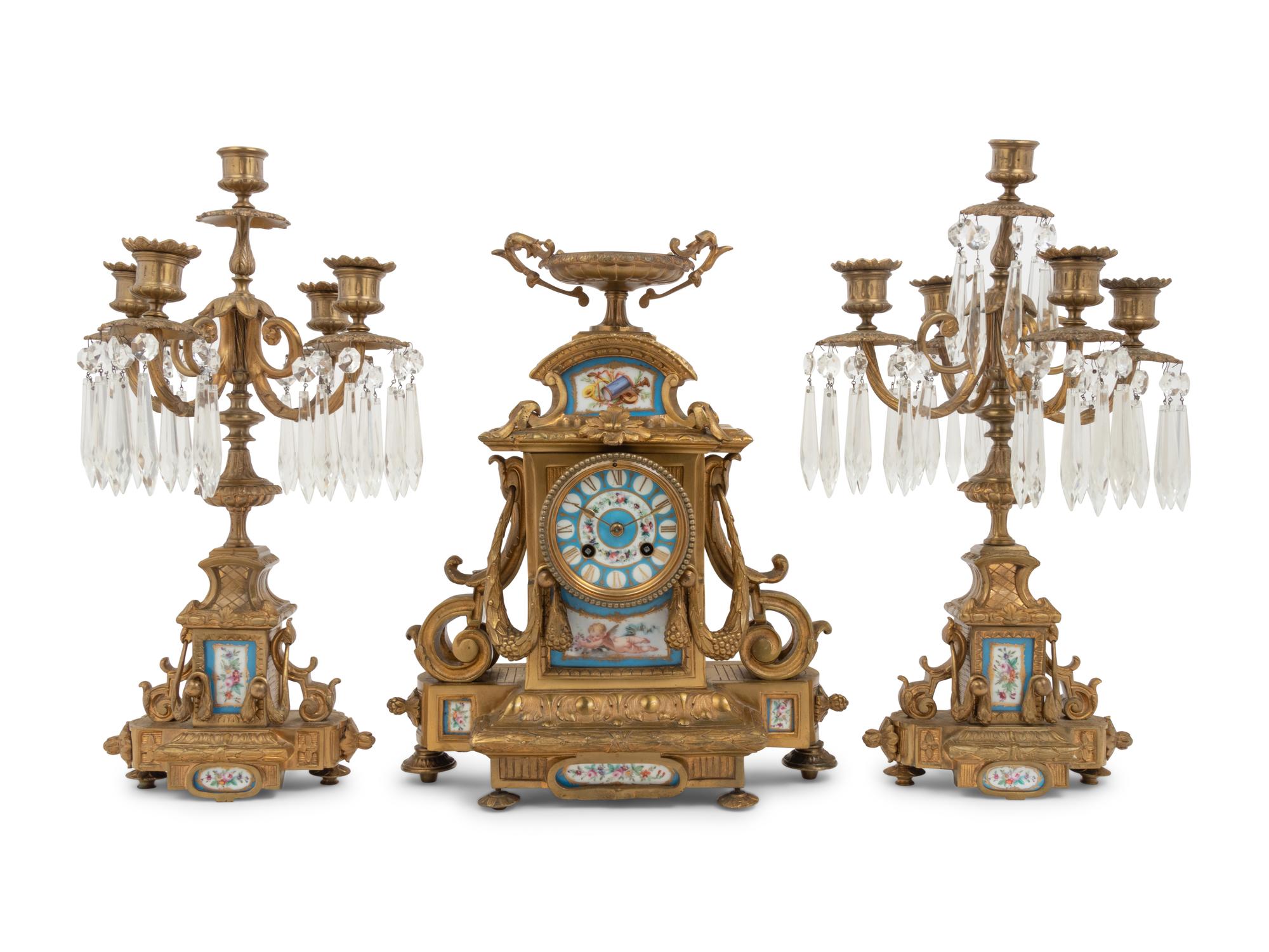 A Napoleon III Style Gilt Bronze and Sèvres Style Porcelain Clock Garniture