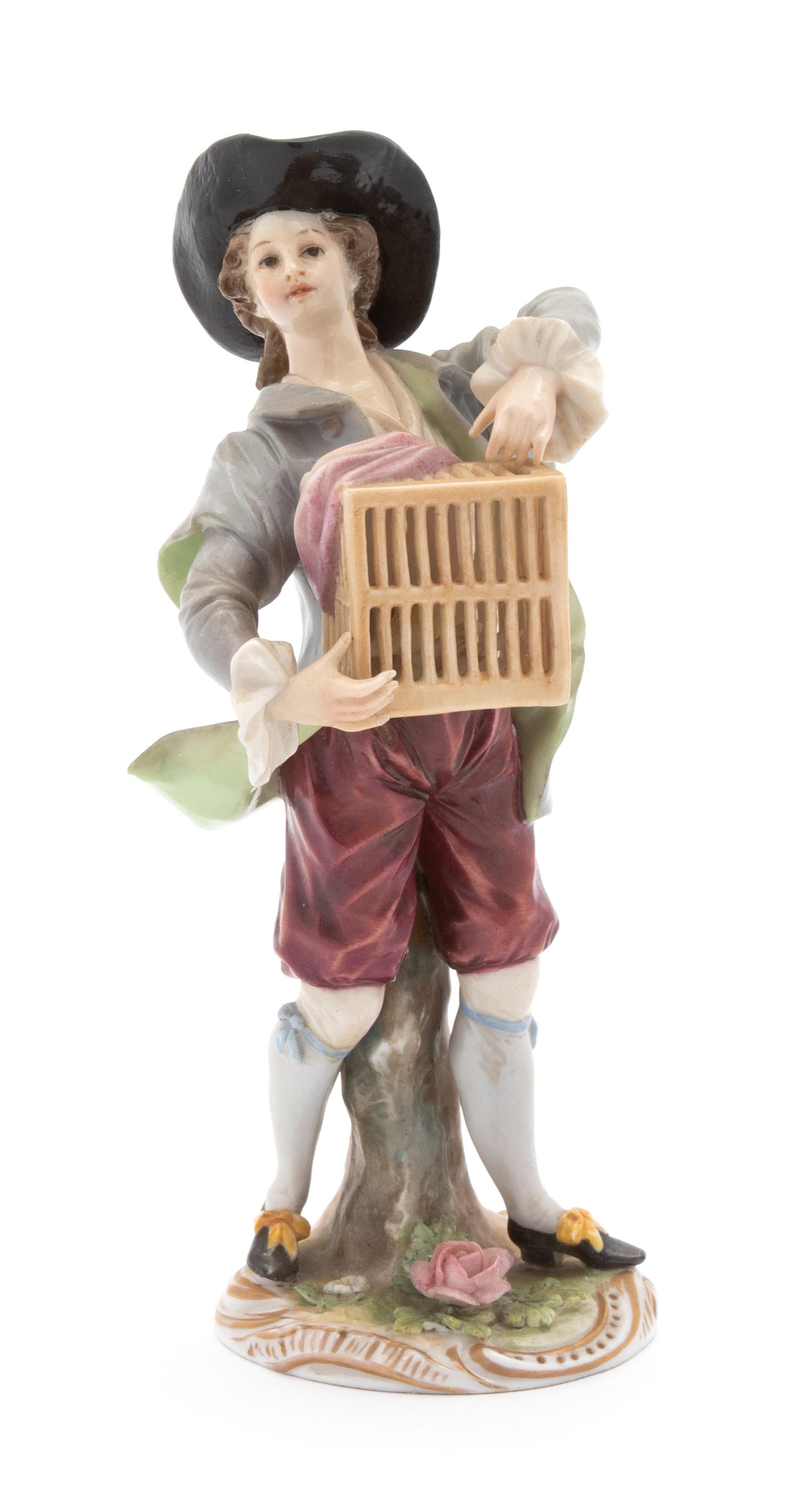 A Ludwigsburg Porcelain Figure of a Boy with Caged Bird Height 6 1/2 inches. — 18TH CENTURY