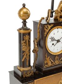 A Louis Philippe Gilt and Patinated Bronze Figural Mantel Clock
