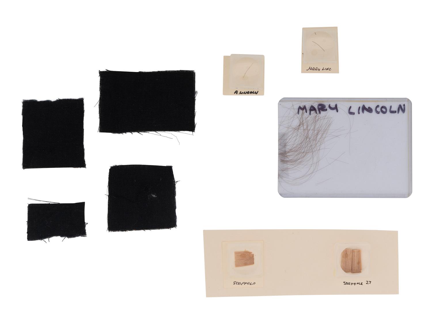 [LINCOLN, Abraham (1809-1865)]. Strands of hair attributed to Abraham and Mary Todd Lincoln displayed with wood fragments from the scaffold used in the execution of the Lincoln conspirators and other relics.