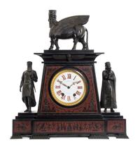 A French Egyptian Revival Bronze and Marble Mantel Clock, retailed by Tiffany & Co., Height overall 24 inches.