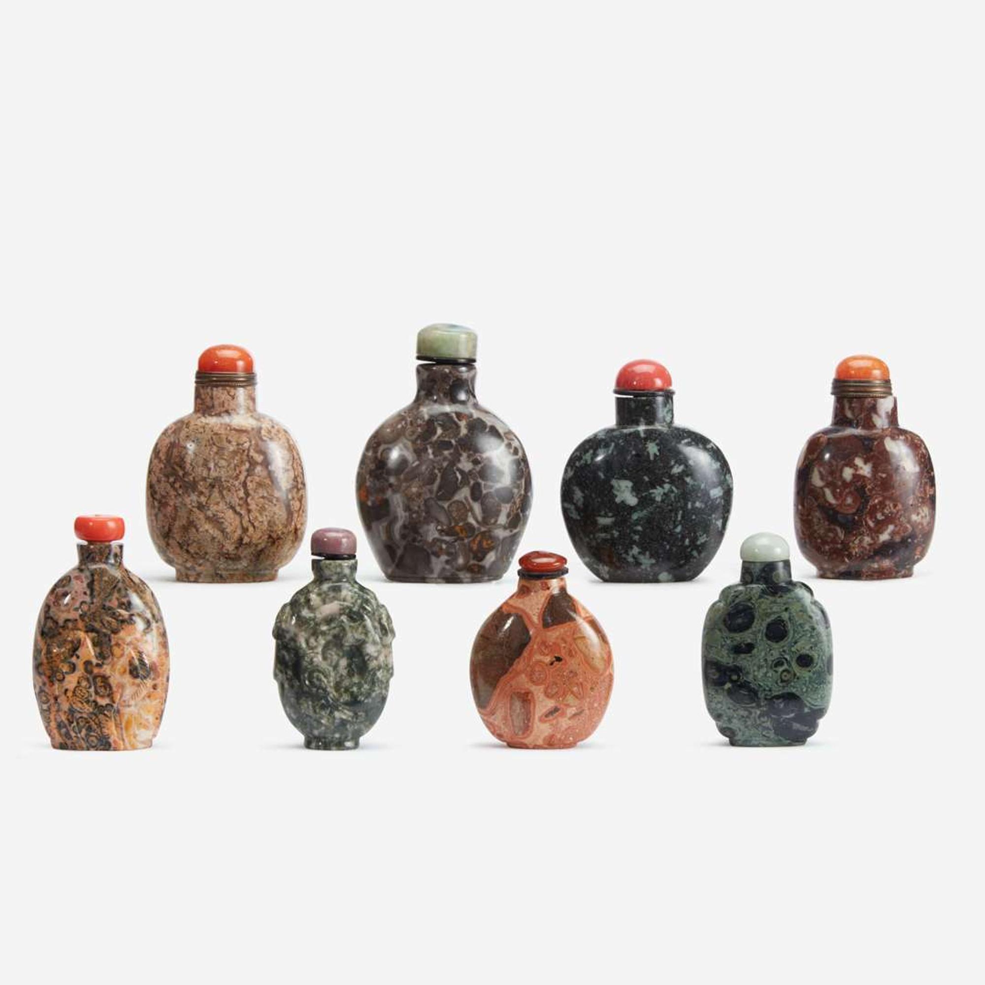 A group of eight Chinese assorted conglomerate and patterned stone snuff bottles