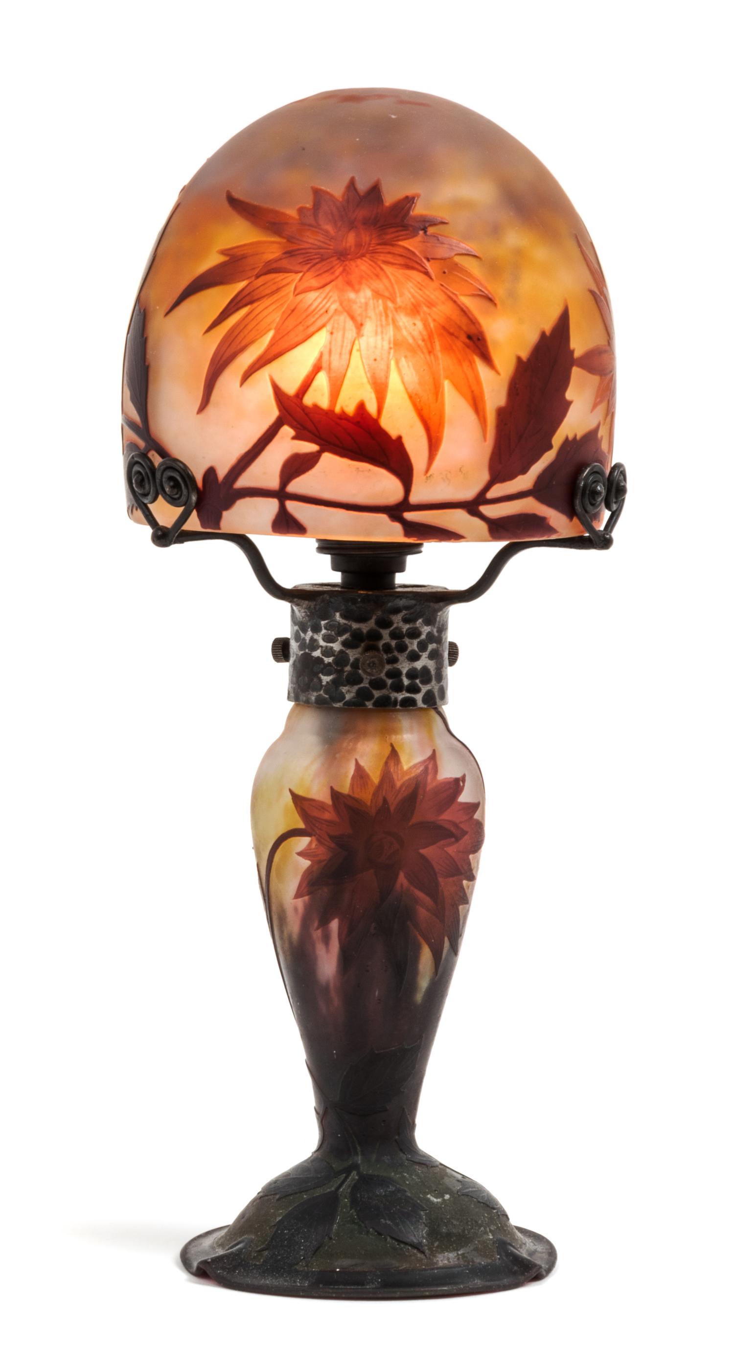 Daum, EARLY 20TH CENTURY, a cameo glass boudoir lamp, the domed shade and baluster form base with flower and leaf decoration