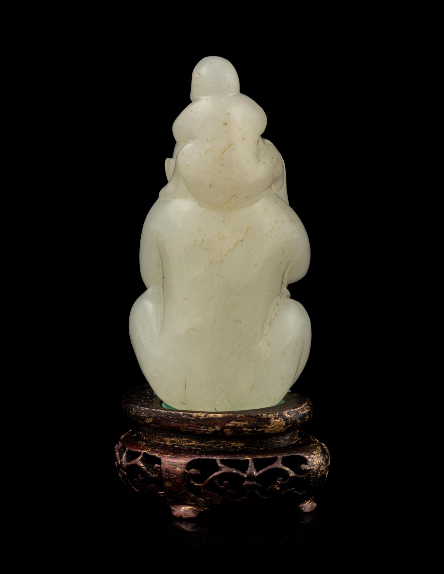 A White Jade 'Monkeys' Carving