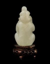 A White Jade 'Monkeys' Carving