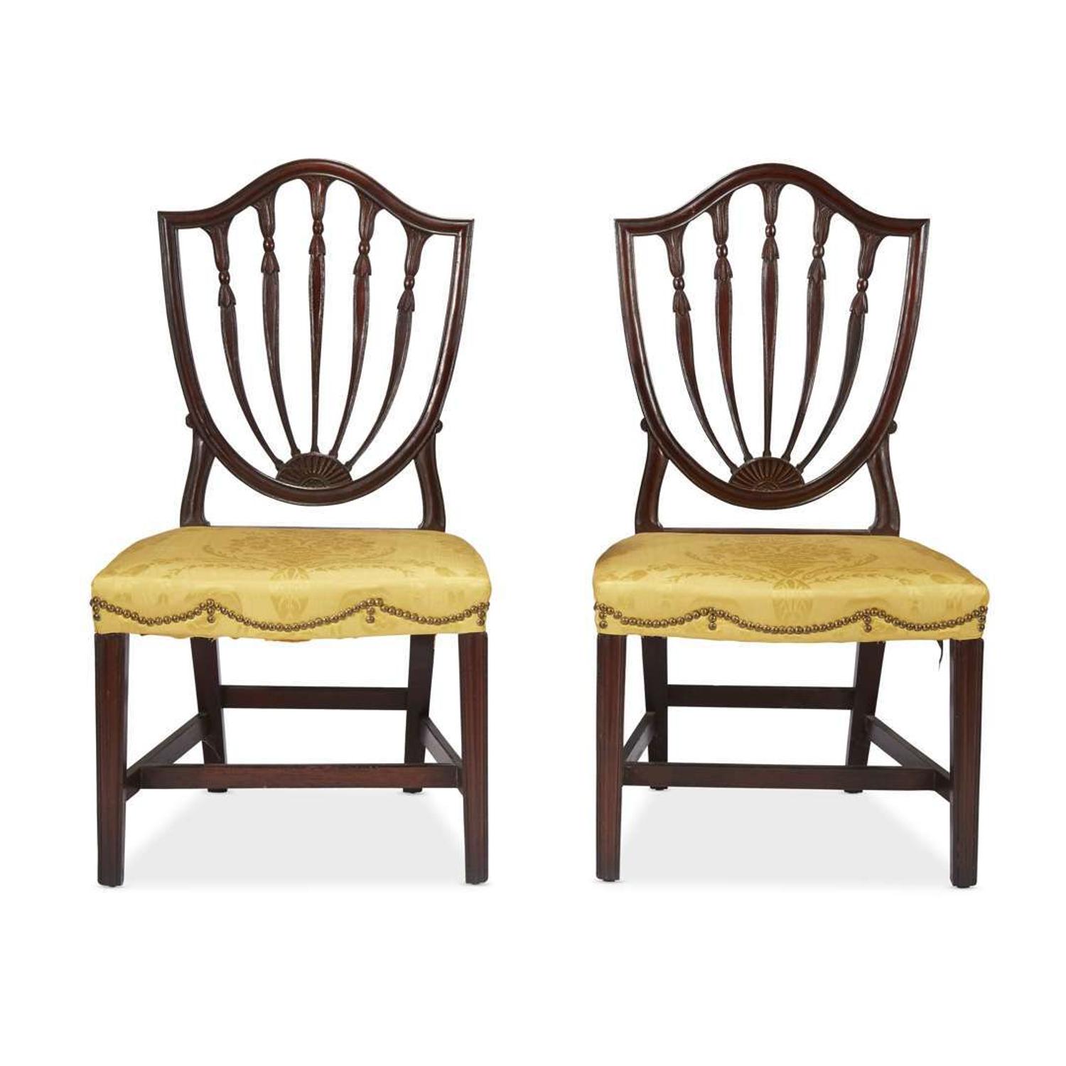 Pair of Federal carved mahogany shield-back side chairs Philadelphia, PA, circa 1800