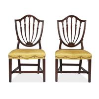 Pair of Federal carved mahogany shield-back side chairs Philadelphia, PA, circa 1800