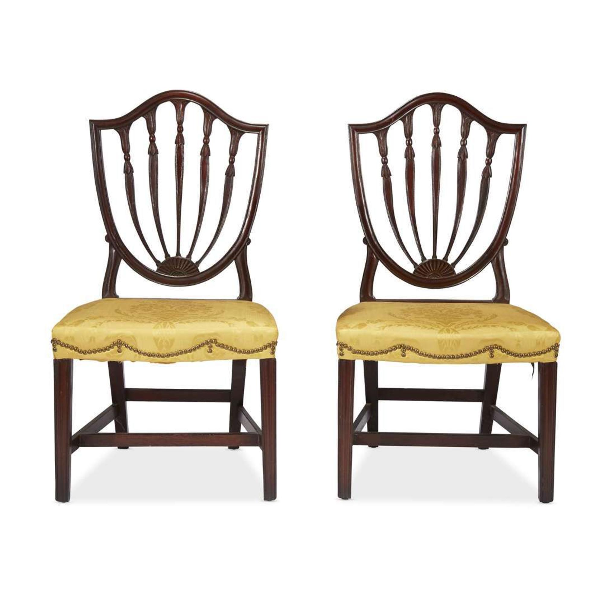 Pair of Federal carved mahogany shield-back side chairs Philadelphia, PA, circa 1800