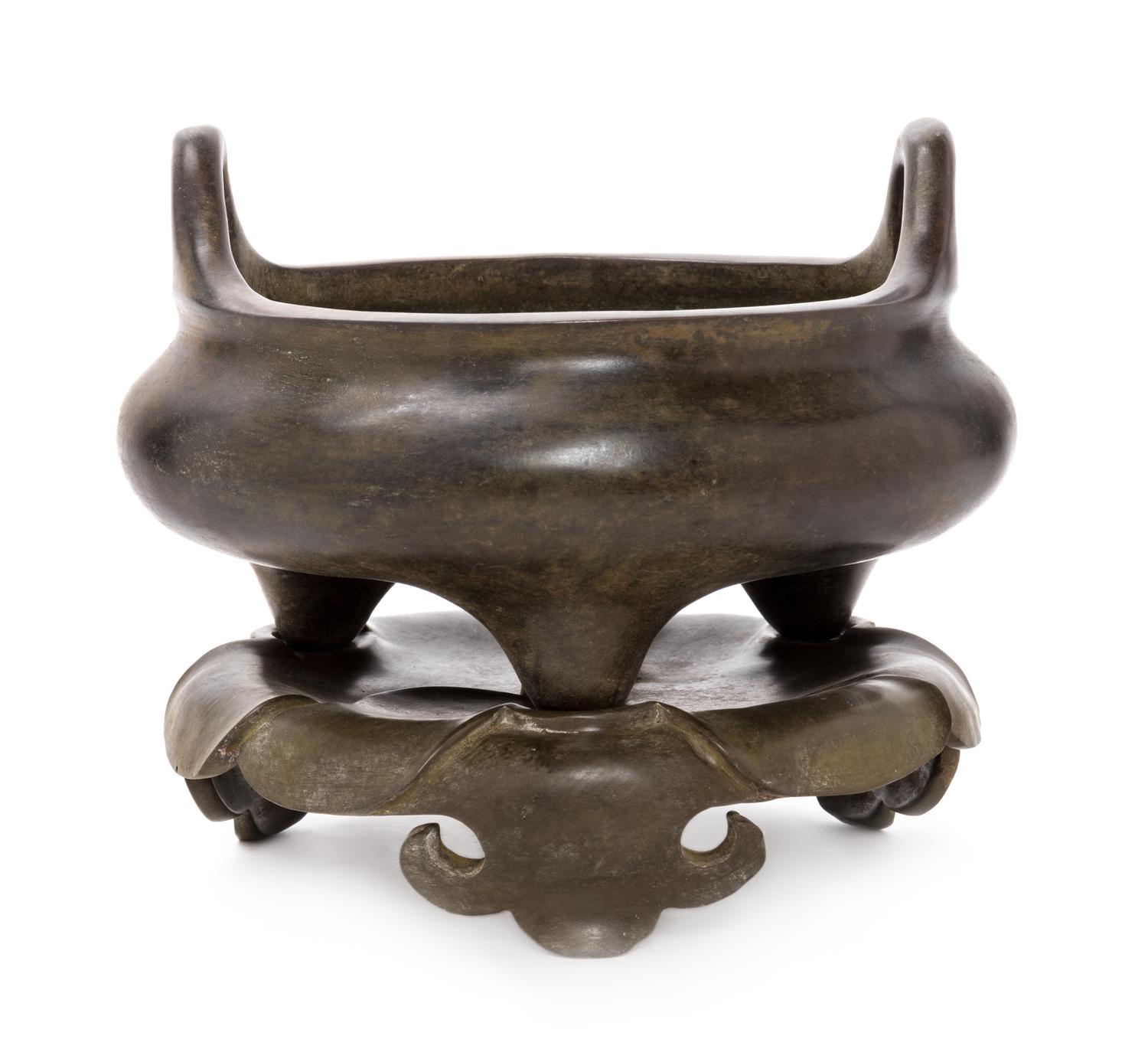 A Chinese Bronze Tripod Censer with Stand Height overall 7 1/2 inches.