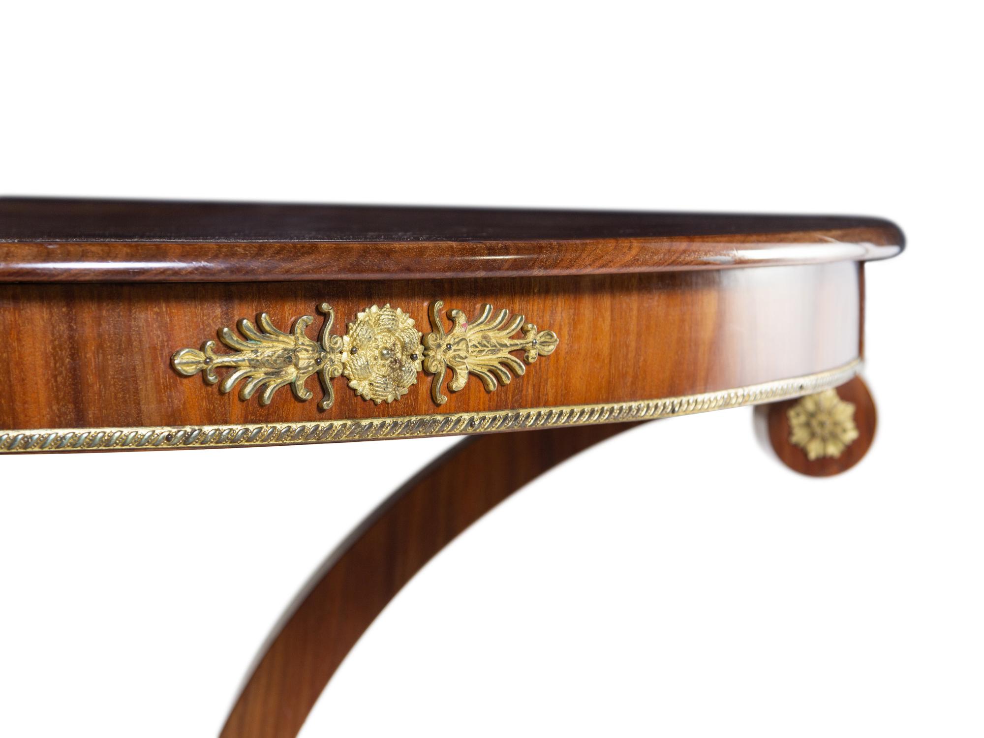 An Austrian Neoclassical Gilt Bronze Mounted Mahogany Center Table