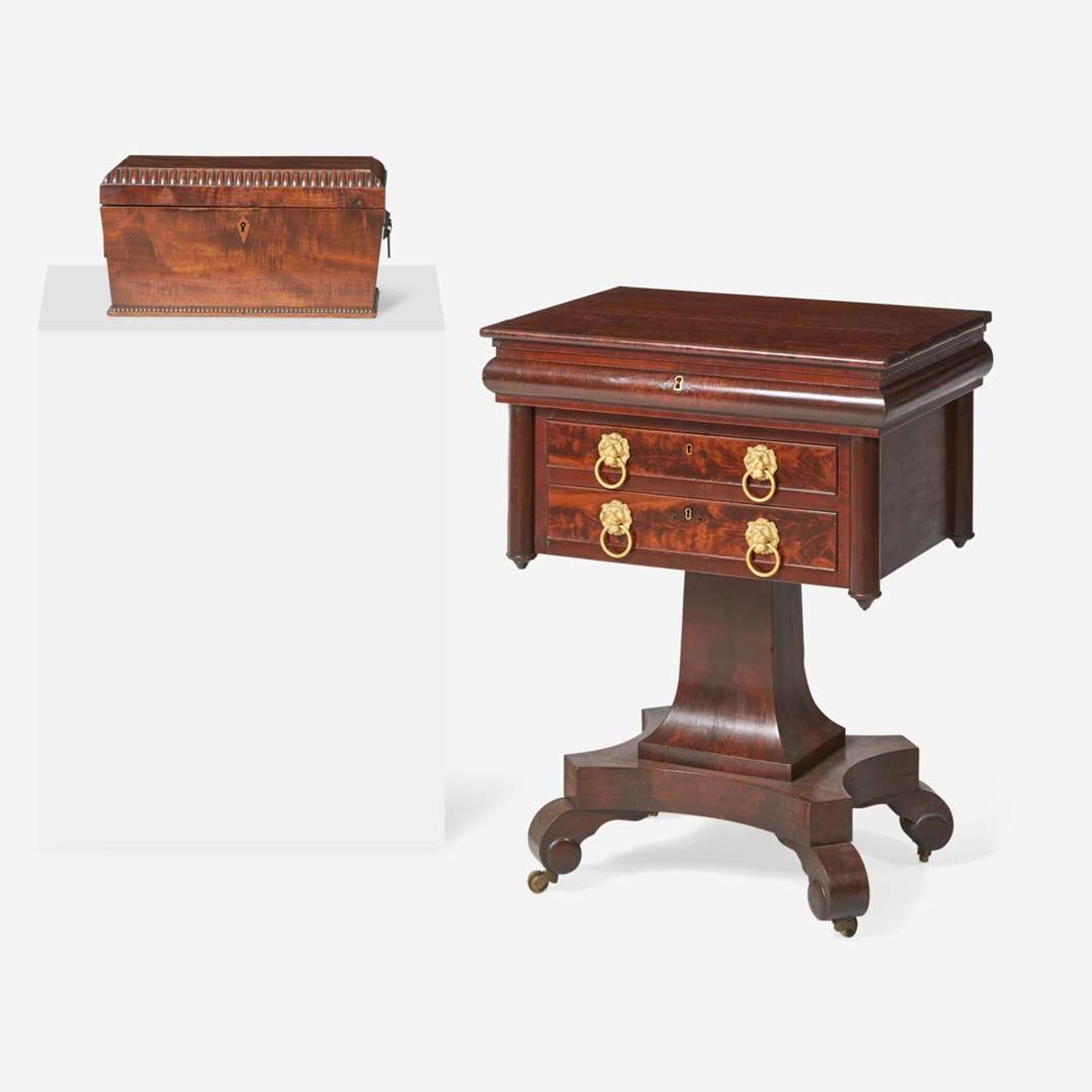 A Classical carved mahogany work table together with Regency mahogany tea caddy The table probably Baltimore, MD, circa 1820-1830