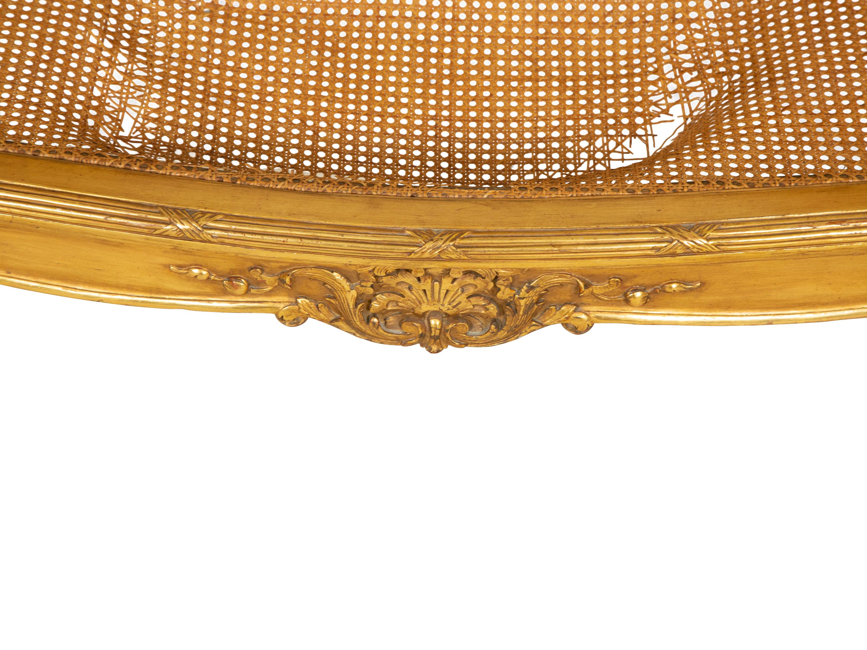A Louis XV Style Caned Giltwood Settee